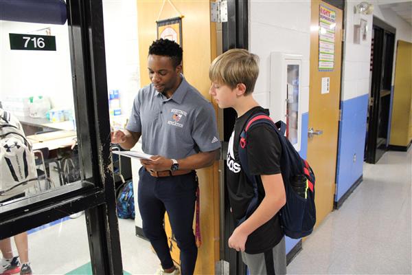 teacher helping a student